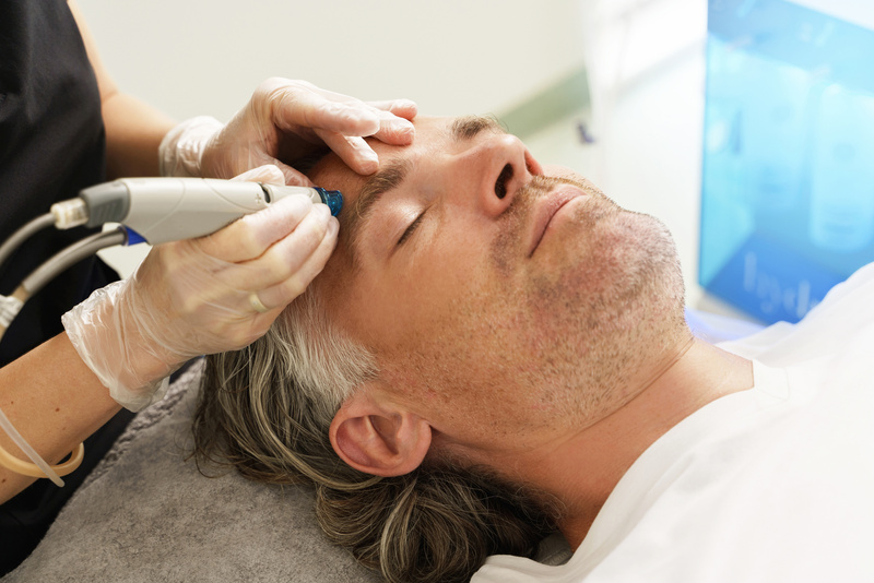 Middle Aged Man during Deep Facial Cleansing in a Cosmetology Cl